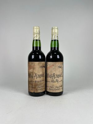 two bottles of wine sitting next to each other on a table