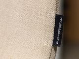 a label on the back of a chair that is not in use