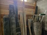 many pieces of wood stacked up in a room