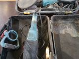 a box with tools in it sitting on the floor