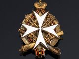 an image of a badge with a white cross on top of it