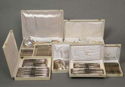 many silverware items in a case on the table