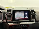 the interior of a car with a view of a car ' s rear view mirror