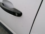 a close up of a door handle on a white car