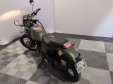 a motorcycle that is sitting on a checkered floor