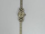 an image of a wrist watch with diamonds on the face