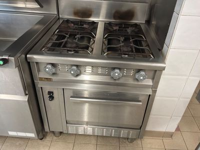 a stainless steel stove and oven in a kitchen