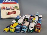 a lot of toy trucks that are sitting next to a book