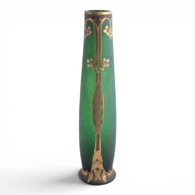 a green vase with gold decoration on it on a white background
