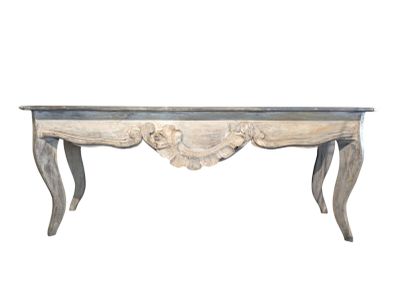 an antique console table with carved legs and a marble top