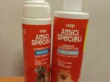 two bottles of dog sham sitting on top of a wooden table