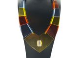 a necklace made of multi colored glass beads on a black mannequin