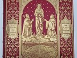 un livre rouge et doré sur lequel figure une image de Jésus et d'autres personnes