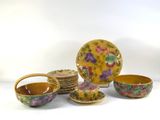 a lot of bowls and plates that are sitting on a table