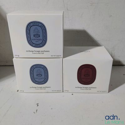 three boxes of soap sitting next to each other on a table