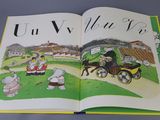 an open book with a picture of a horse drawn carriage