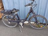a bike that is parked in front of a building