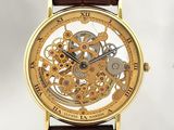 an image of a close up of a watch with a brown strap