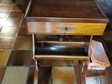 a piano sitting on a tiled floor in a room