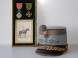 a hat that is sitting next to a picture of a horse