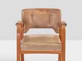 an image of a brown leather chair on a white surface
