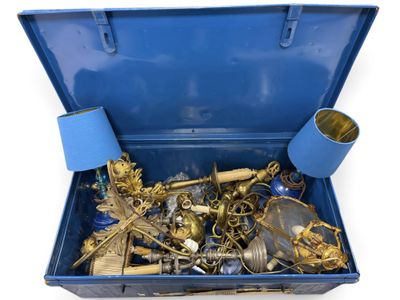 a blue suitcase filled with lots of gold and silver items