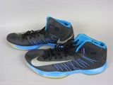 pair of black and blue nike basketball shoes on a white surface