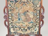 an ornately decorated screen with a picture of a woman on a horse