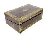 a small wooden box with a decorative design on it