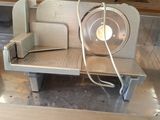 a metal bench with a fan on top of it