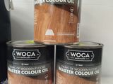 three tins of wood floor paint and a can of wood floor paint