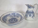 a blue and white bowl and a blue and white pitcher