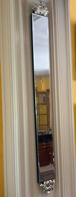 a mirror hanging on the wall in a room