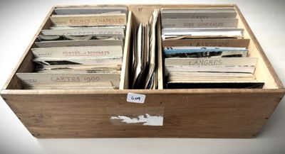 a wooden box with a bunch of records in it