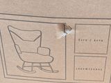 a cardboard box with a picture of a rocking chair on it