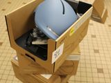 a cardboard box with a computer in it on the floor