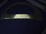 a close up of a piece of metal with writing on it
