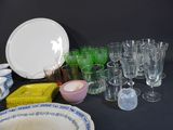 a lot of dishes and glasses on the table