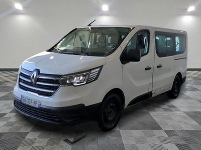 the white van is parked on a checkered floor in a room