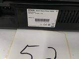a close up of a printer on a table with a number on it