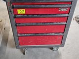 a red tool box sitting on top of a metal cart