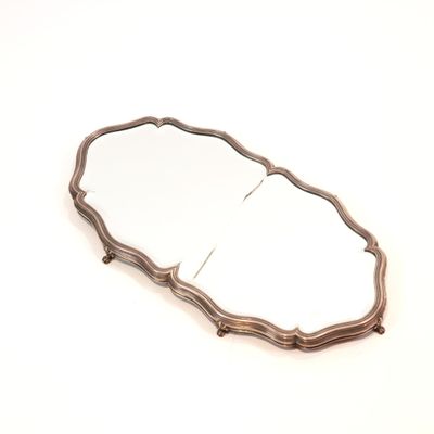 an image of a mirror on a white surface with a wooden frame