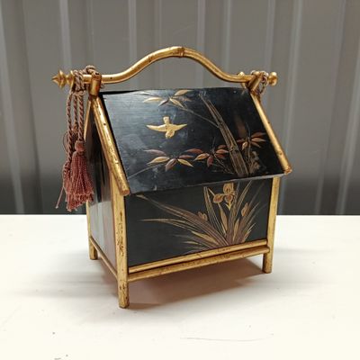 a black and gold box sitting on a table