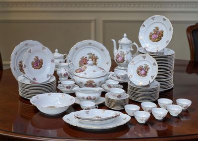 a lot of plates and cups on the table