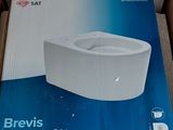 boxed box of a toilet sitting on the floor in a room