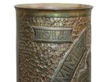 a metal container with a design on it