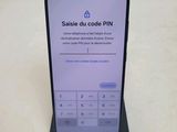 the phone is sitting on top of a stand with a keypad on it