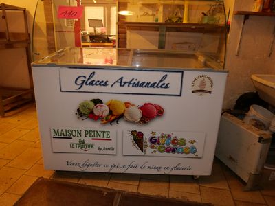 a display of ice creams in a glass case