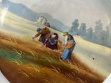 a plate with a painting of a farmer and a woman