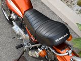 a close up of a motorcycle parked on the side of the road